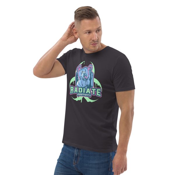 Man with body inclined to his right, looking at the left with his right arm touching the back of his head for stylish posing purposes, wearing a t-shirt with some kind of Radioactive Evil Snowman with the radioactive symbol behind and the quote "Radiate Positivity", this trying to be a funny radiation pun.