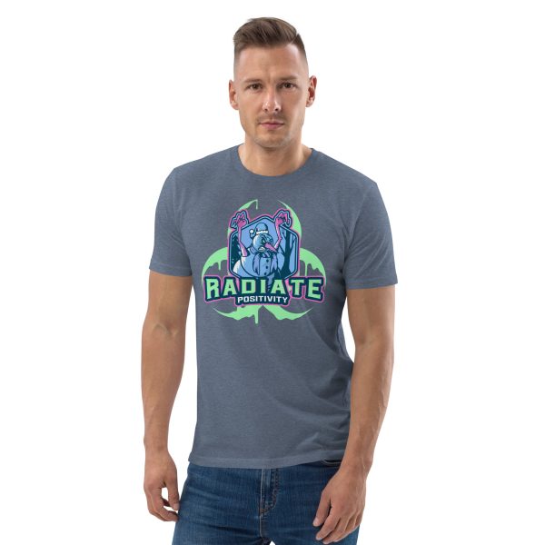 Man with hands in a neutral position and body slightly inclined to the right looking straight at you while wearing a t-shirt featuring some kind of Radioactive Evil Snowman with the radioactive symbol behind and the quote "Radiate Positivity", this trying to be a funny radiation pun.