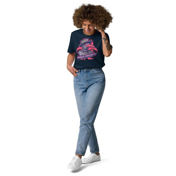 Woman with legs crossed, right hand on her pocket and left hand on her face looking down smiling and posing in a fashionable way while wearing a sustainable organic cotton t-shirt with the design of a plague doctor and the radioactive symbol behind with the quote "Radiate Positivity" trying to be a creative and funny Radiation pun t-shirt
