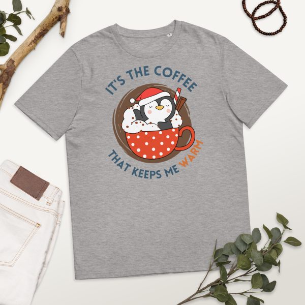 Penguin taking a bath in a coffee cup filled with cream and chocolate. The penguin looks comfortable and happy, and it is part of the design of the t-shirt featured in the image.