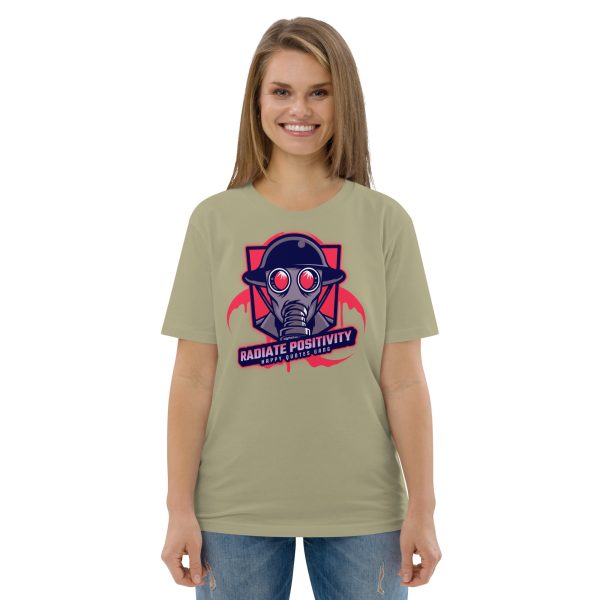 Woman smiling directly at you with her hands in a netural position, showing her t-shirt with the design of a soldier with a gas mask and the quote "Radiate Positivity", intended to be a funny radiation pun.