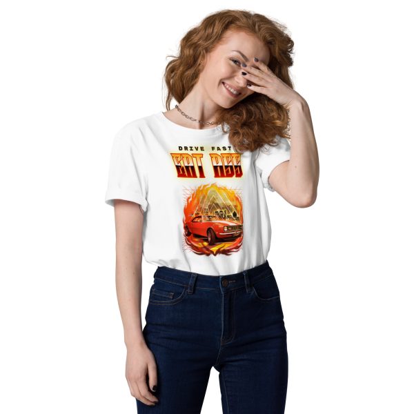 Woman smiling and covering her face with her left hand wearing a t-shirt with a racing car in flames and explosions in the back with the quote Drive Fast Eat Ass