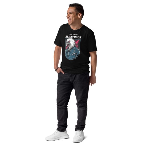 Man smiling looking at his right with his right hand on his pocket wearing a t-shirt with the coold design of an eagle and the text Coz' I'm an Albatraoz, not intentionally related to any song or phrase from the internet.