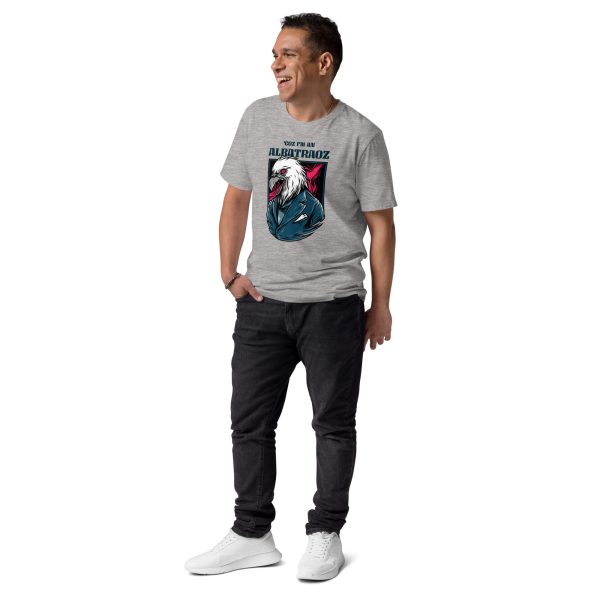 Man smiling looking at his right with his right hand on his pocket wearing a t-shirt with the coold design of an eagle and the text Coz' I'm an Albatraoz, not intentionally related to any song or phrase from the internet.