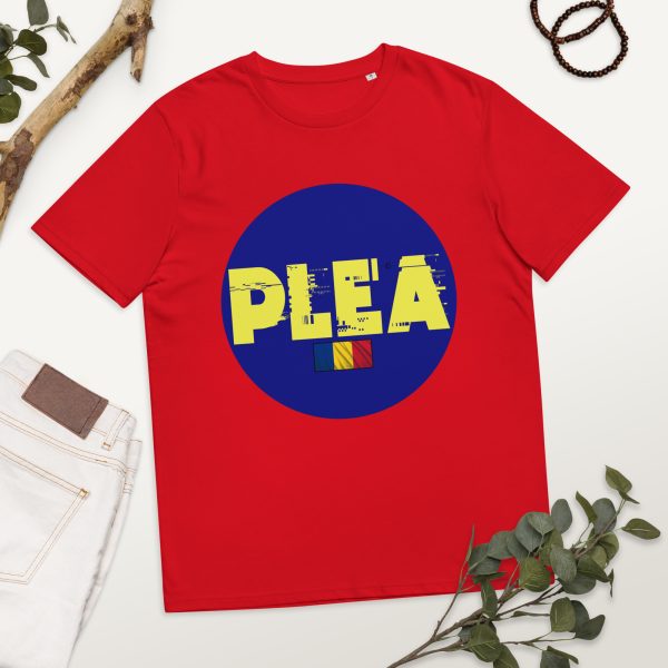 T-shirt featuring PLEA's logo in the middle of it and occupying much of the space of the t-shirt, which is positioned in a photographic set with flowers and decorations, also with a pair of jeans to the left