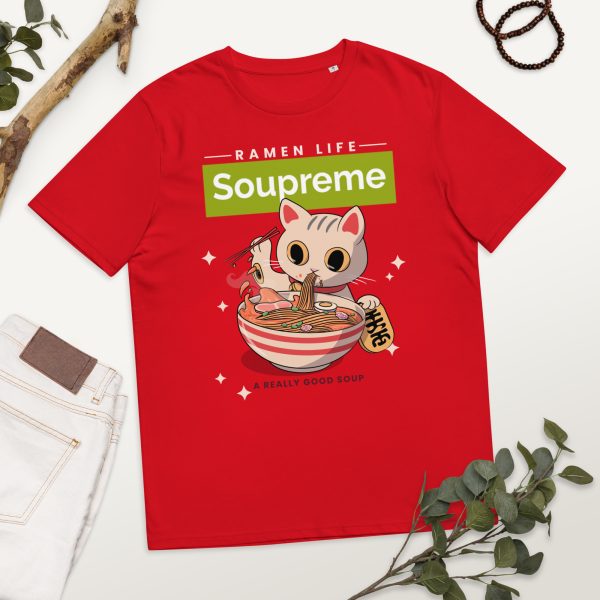 Organic cotton t-shirt in a photographic background with decorative elements, featuring a design of a japanese manga/anime cartoonish style cat eating ferociously a bowl of ramen noodle soup. Above there is a logo that reads: Soupreme; not being related to any particular brand and intended as a funny pun regarding the main subject of the design, which is ramen noodle soup.