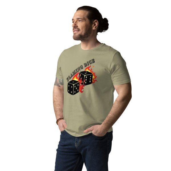 Man standing in a confident pose looking straight with proud and both of his hands in the pockets of his pants. He is wearing a t-shirt that features the design of two dice on flames and the text Flaming Dice on top