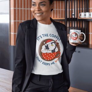 It's the coffee that keeps me warm - penguin drinking coffee from a cup - women t shirt and mug